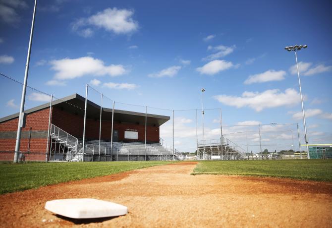 Baseball field under blue sky and some clouds