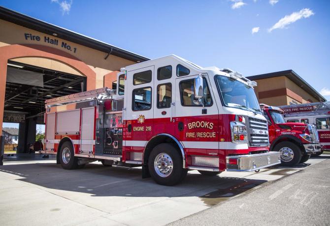 Firetruck parked in front of a City of Brooks fire station